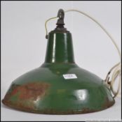 A vintage mid century Industrial enamel painted factory light shade.