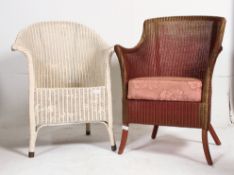 A good Lloyd Loom style conservatory armchair together with another.