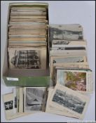 A collection of 400 - 500 postcards dating from the early 20th century to include mainly