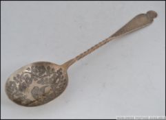 A large silver hallmarked spoon with deep bow,