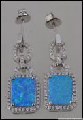 A pair of silver and CZ opalite drop earrings