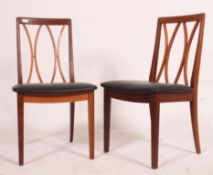 2 1970's G-Plan teak lattice back retro dining chairs raised on tapered legs with overstuffed