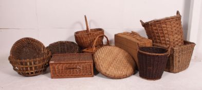 A large collection of whicker items dating from the 20th century to include oyster basket,