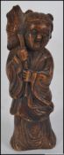 An unusual chinese Okimono carved figure of an elder in hardstone