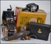 A collection of vintage camera and cine camera parts and accessories to include a cased 8mm cine