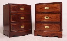 A stunning pair of mahogany brass campaign inlaid bow front bedside chests of drawers being of