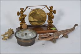 A mixed lot of metalware - vintage Pixie table gong with oak base, large crocodile nutcrackers,