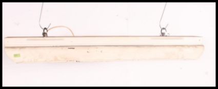 A retro vintage early 20th century Industrial factory strip light fitting, industrial look and feel,