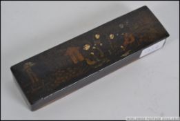 A 19th century lacquered travelling pen box, being decorated to the top with court scenes.
