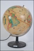 A contemporary late 20th century desk top globe with light up interior bearing makers name etc.