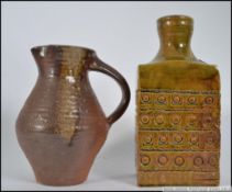 A studio pottery lamp base in the manner of Troika signed to the base Avril Chorley along with