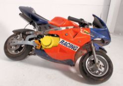 A mini moto motorbike with engine etc ( sold untested ). Measures: 100cm L.