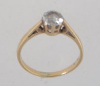 A hallmarked 9ct gold ring with single clear stone in a prong setting approx 75pts.