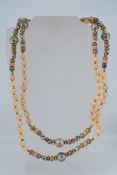 A vintage agate bead necklace with yellow and white metal beads. Measures 75 inches. Weight 144g.