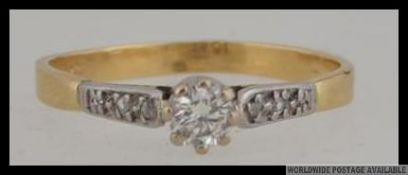 An 18ct gold and diamond solitaire ring with central diamond approx 20pts.