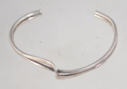 A 925 silver cuff bangle bracelet with wrap over twist decoration. Marked 925. Weight 14g.