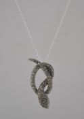 A contemporary ladies silver and marcasite snake pendant and necklace chain.