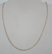 A hallmarked 9ct gold flat link curb chain necklace with spring hoop clasp. Hallmarked London.