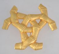 A large gold tone channel style faux bamboo brooch pin with roller clip clasp. Measures 8.5cms.