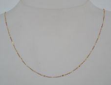 A 9ct gold fancy figaro chain necklace with spring hoop clasp. Marked 9ct, tests 9ct gold.