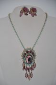 A vintage 1960s demi parure set consisting of a rhinestone set necklace and clip on earring set in