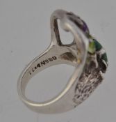 A retro Brutalist 1970's Mexican silver ring set with ametrine and green gem stones. Size M.