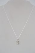 A 925 silver Art Deco style pendant necklace set with round and baguette cut CZ on a belcher link