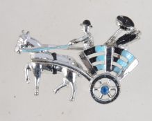 A vintage 1950's white metal enamelled figural brooch pin in the form of a man and cart (possible