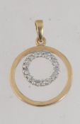 A hallmarked 9ct gold and diamond halo pendant set with diamonds in a channel setting approx 15pts.