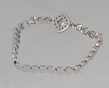 A 925 silver Art Deco style bracelet with pave set CZ heart links and square locket style invisible