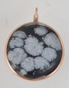 A hallmarked Edwardian 9ct gold pendant with inset large snowflake obsidian cabouchon .