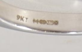 A hallmarked 9ct white gold and diamond ring with single stone being claw mounted approx. 25pnts .