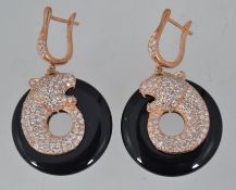 A pair of 925 designer silver gilt and onyx earings decorated with a panther encrusrted with CZ