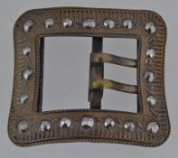 An Edwardian large brass buckle set with faceted marcasite stones with twin prongs. Measures 7.