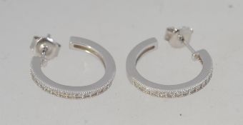 A pair of 925 Art Deco style silver earrings with channel set CZ with post backs.