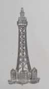A vintage figural pewter brooch pin in the form of the Eiffel Tower with C clasp. Measures 5cms.