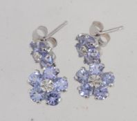 A pair of 10ct white gold tanzanite and diamond drop earrings set with diamonds and tanzanite in a