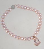A 9ct gold and pearl bracelet with a diamond chip encrusted 9ct white gold ball clasp with rose