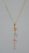 A hallmarked 9ct gold pearl drop pendant necklace with double pearl Art Nouveau style drop.