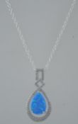 A silver ladies opalite and cz adorned teardrop pendant and necklace.