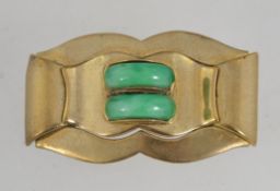 A 1930's Art Deco Czech yellow metal brooch pin set with two jade peking glass arcs with a trombone