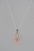 A 925 silver rococo style pendant necklace set with a faceted rose quartz pendant on a belcher link