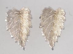A pair of vintage 925 silver clip on earrings in leaf form. Marked Sterling Silver. Measures 2.
