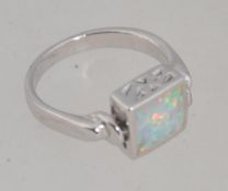 A ladies decorative silver revolving opal and fret pierced dress ring. Total weight 4.
