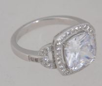 A large ladies modern silvern and cz adorned dress ring,