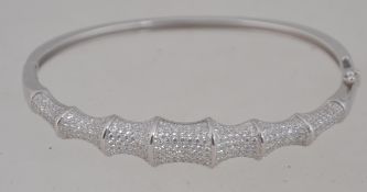 An unusual ladies silver and cz stone stone bangle / bracelet in the form o bamboo.