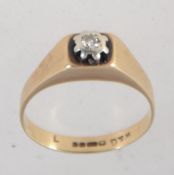 A hallmarked 9ct gold and diamond ring set with a single diamond in a star setting approx 5pts.