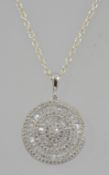A 925 silver pendant necklace with CZ baguette and pave set CZ concentric circles strung on a fine