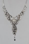 A good vintage festoon necklace with paste set stones and a pair of matched drop earrings in a blue