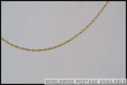 A 9ct gold rope chain with spring hoop clasp. Marked 9ct.